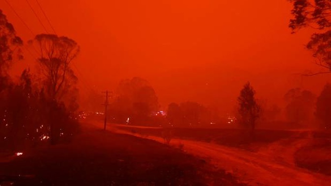 Fire and thick smoke in the village of Nerrigundah, Australia. Photo / AP
