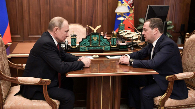 Russian President Vladimir Putin meets with Prime Minister Dmitry Medvedev in Moscow on January 15. (Photo / Getty)