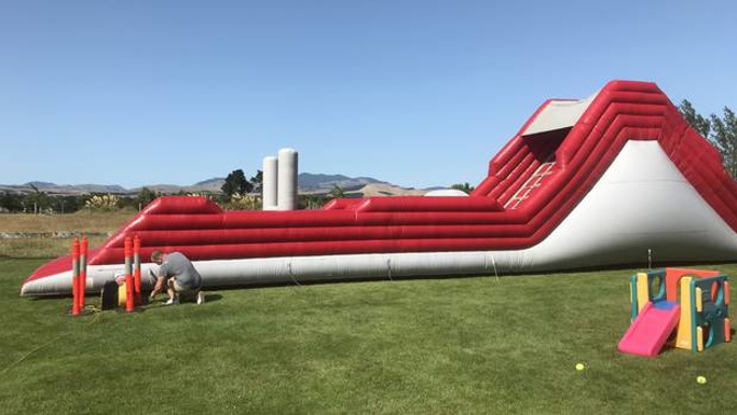 Blocking the picturesque rolling hills and vineyard was a sizable, inflatable bouncy slide. Photo / Jason Walls