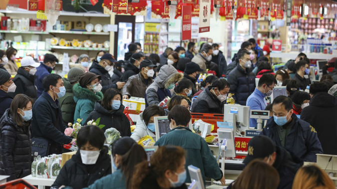 Residents in Wuhan shopping under the cloud of containment. (Photo / AP)