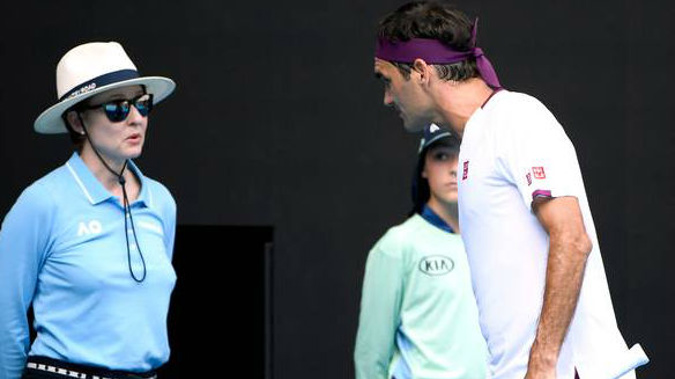 Roger Federer questions a line judge during his Australian Open quarter-final against Tennys Sandgren. (Photo / AP)