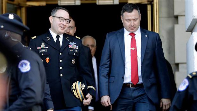 Lt. Col. Alexander Vindman, left, walks with his twin brother, Army Lt. Col. Yevgeny Vindman, after testifying. Photo / AP