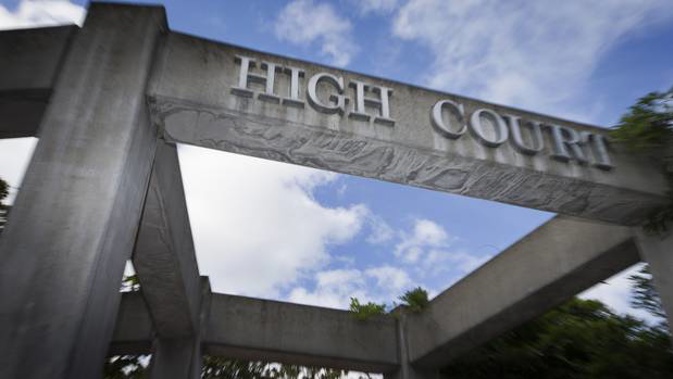 A woman on trial for murdering her partner says she suffered battered woman's syndrome. (Photo / File)