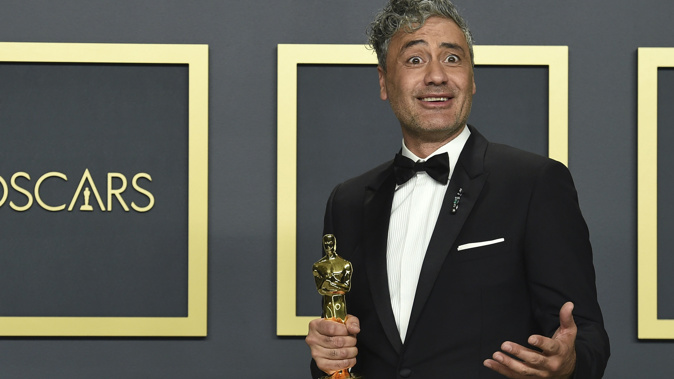 Taika Waititi accepts the award for best adapted screenplay for 'Jojo Rabbit'. Photo / AP