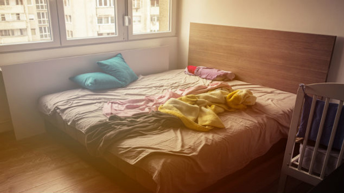 A landlord has been ordered to pay his tenant $600 after taking a photo of her lying in bed without her knowing. (Photo / Getty)