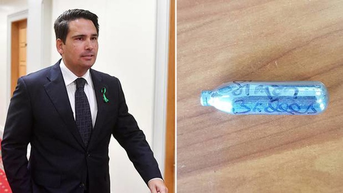 National Leader Simon Bridges has been labelled "blissfully unaware" after signing a nitrous oxide canister, an item that is often used as a recreational drug. Photo / Getty Images / Twitter