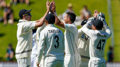 The Black Caps celebrate during their 100th test win. Photo / Photosport