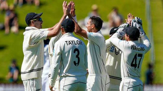 The Black Caps celebrate during their 100th test win. Photo / Photosport