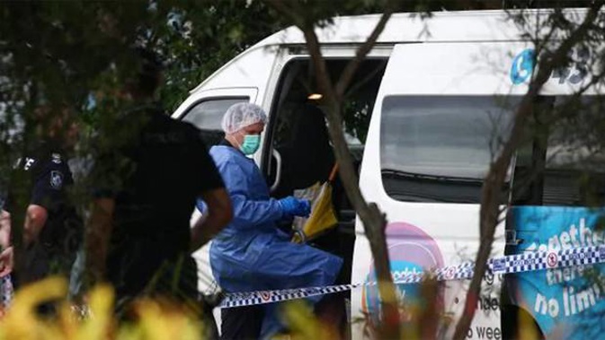 A police forensic officer inspects the minibus in Cairns. (Photo / Supplied)