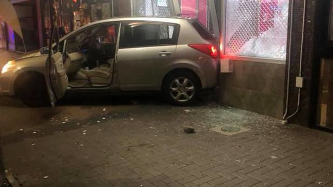 A small hatchback car abandoned at the scene of a ram raid on an Auckland jewellers on Saturday night. Photo / Facebook