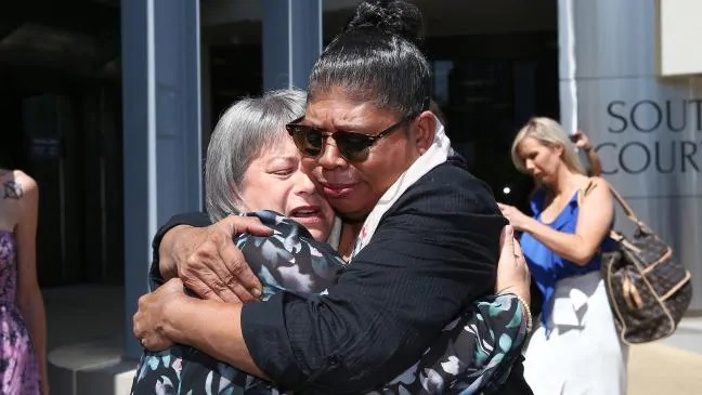 Donna Baluskas breaks down after meeting Kathleen Toplis outside court, Kathleen told Donna her son took his own life after attending Tamborine Mountain State High School. Picture: Adam HeadSource:News Corp Australia