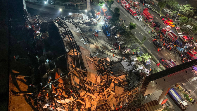Rescue operations continue in the mangled wreckage of the collapsed hotel in the city of Quanzhou, China