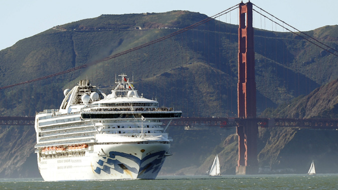 The Grand Princess cruise ship passes the Golden Gate Bridge as it arrives from Hawaii in San Francisco. (Photo / AP)