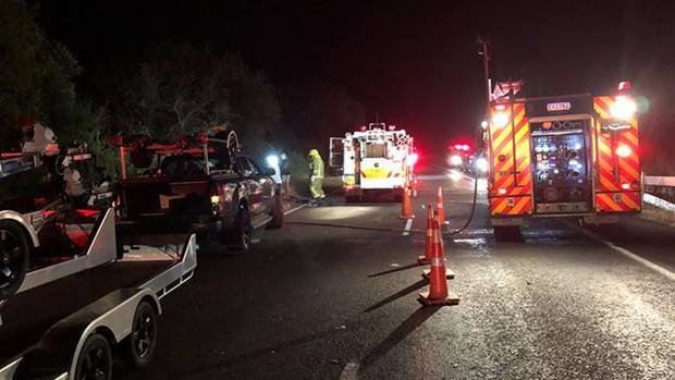 Emergency teams at the scene of the crash. Photo / Stan Kado