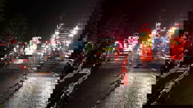 Emergency teams at the scene of the crash. Photo / Stan Kado