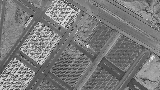 Satellite image of a cemetery in Qom  appears to show new burial plots that were not in images taken before the coronavirus outbreak. (Image / Maxar Technologies via CNN)