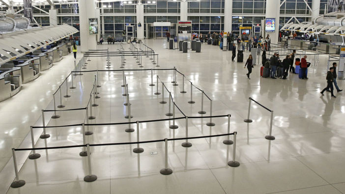 People visit an international terminal at John F. Kennedy airport, shortly before the travel ban. (Photo / AP)