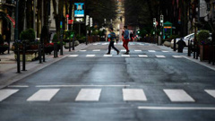 Pedestrians pass an empty Gran Via street, in Bilbao, northern Spain. Photo / AP