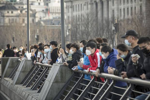 People wearing protective masks in Shanghai, China. Photograph / AP