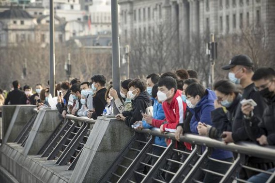 People wearing protective masks in Shanghai, China. Photograph / AP