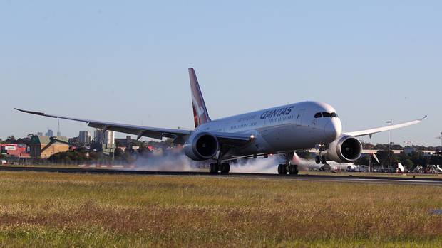 A Qantas Dreamliner lands at Sydney. Photo / James D Morgan