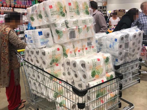 These shoppers in Pukekohe this morning had their trolleys stacked high with toilet paper. (Photo / Shaun Murray)