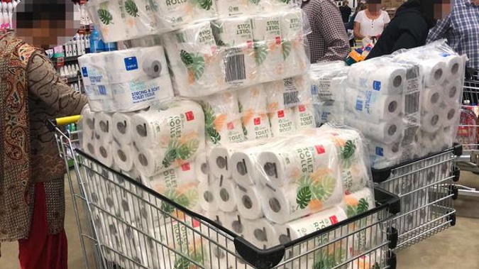 These shoppers in Pukekohe this morning had their trolleys stacked high with toilet paper. (Photo / Shaun Murray)