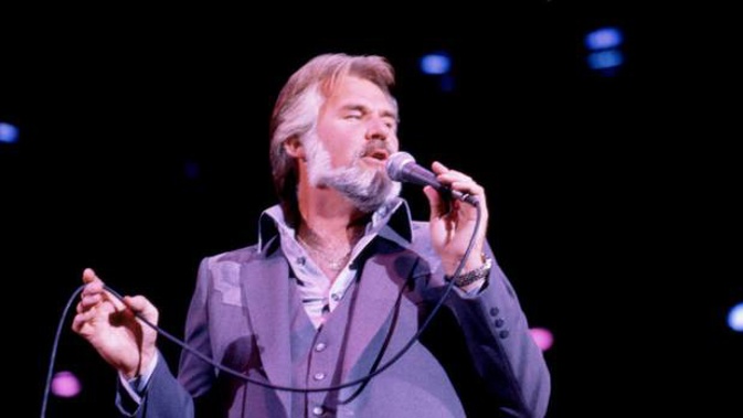 Kenny Rogers sings on stage in 1981. Photo / Getty Images