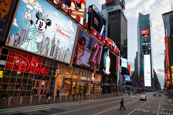 Time Square is unusually empty as New York goes into lockdown. (Photo / AP)