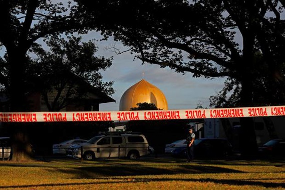 A police officer stands guard in front of the Masjid Al Noor mosque in Christchurch following the attacks. Photo / AP