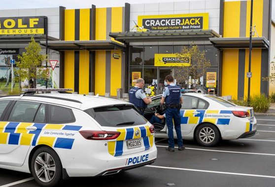 Police officers enforcing the Covid-19 lockdown paid a visit to a Crackerjack store in Hamilton this morning. Photo / Mike Scott