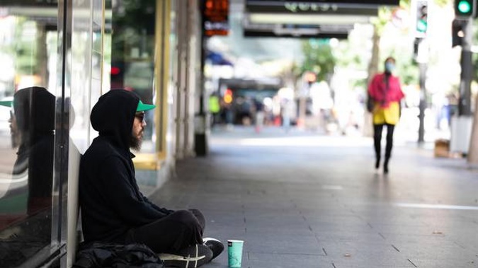 A homeless person on Queen St, Auckland, before the Covid-19 level 4 lockdown was enforced. Photo / Brett Phibbs