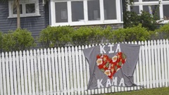 A house on Titirangi Rd in West Auckland displays a "Kia Kaha" banner during the lockdown. Photo / Alex Burton