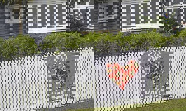 A house on Titirangi Rd in West Auckland displays a "Kia Kaha" banner during the lockdown. Photo / Alex Burton