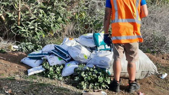 A Mangere local who went on her morning walk was shocked to find a pile of courier packages strewn across the grass. Photo / Shane M Twitter