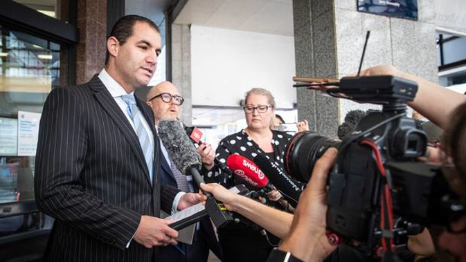 Jami-Lee Ross speaks to the media with his lawyer Ron Mansfield, outside the Auckland District Court, in February. Photo / Jason Oxenham
