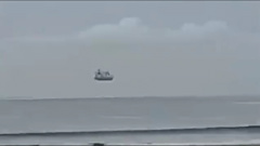 The footage filmed from a beach at Mount Maunganui in New Zealand showed the vessel seemingly suspended above the ocean last week. Video / Monika Schaffner