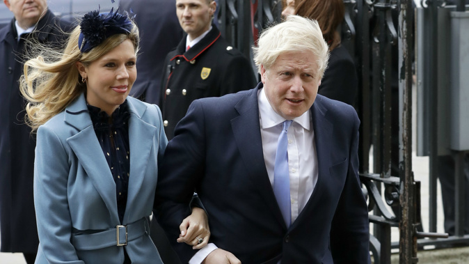 Boris Johnson with his partner, Carrie Symonds. (Photo / AP)
