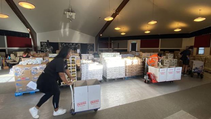 Staff at social service organisation VisionWest prepare goods to deliver to those in need in West Auckland. Photo / Supplied