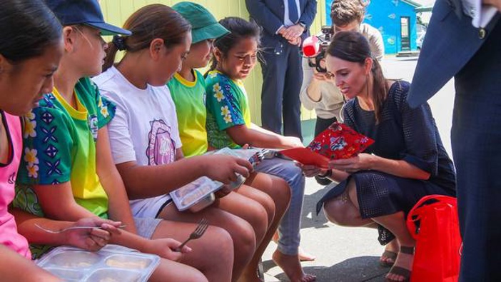 Jacinda Ardern shares a child's free school lunch at Flaxmere Primary School in Hawke's Bay in February. Free lunches will be expanded to 200,000 students by next year. Photo / Hawkes Bay Today