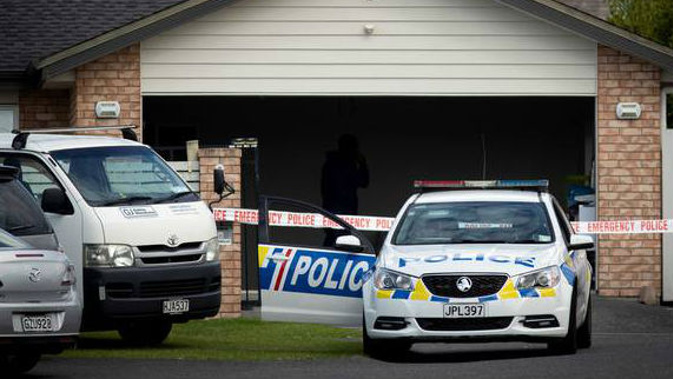 Police search a home in West Auckland last month over the disappearance of Ricky Wang. Photo / Dean Purcell