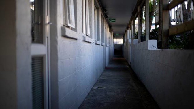49-year-old Angela Joy Smith was stabbed to death at the block of flats where she lived in West Auckland. Two men have been charged with murder. (Photo / Dean Purcell)
