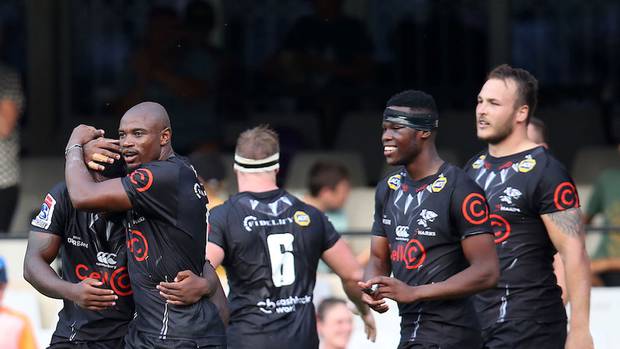 Makazole Mapimpi of the Sharks celebrates a try with teammates. (Photo / Supplied)