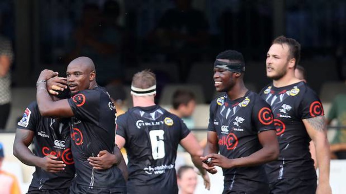 Makazole Mapimpi of the Sharks celebrates a try with teammates. (Photo / Supplied)