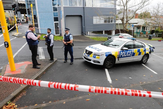 Police on the scene in Grafton, Auckland, this morning. (Photo / Dean Purcell.)