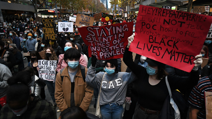Protesters are seen during a Black Lives Matter rally in Melbourne. (Photo / AAP)