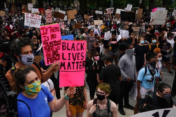 People gather outside the Georgia State Capitol during a protest against police brutality in Atlanta. Photo / Getty Images