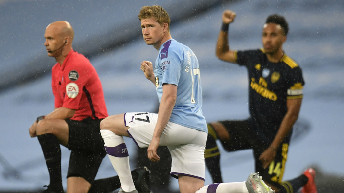 Manchester City's Kevin De Bruyne takes a knee in support of the Black Lives Matter movement before the English Premier League soccer match between Manchester City and Arsenal. (Photo / AP)