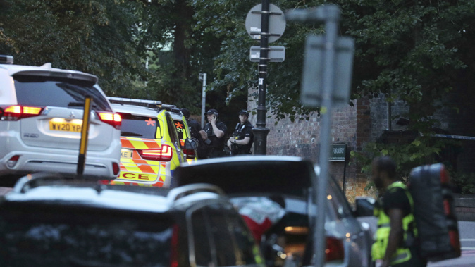Police work at Forbury Gardens in the town centre of Reading, England. (Photo / AP)