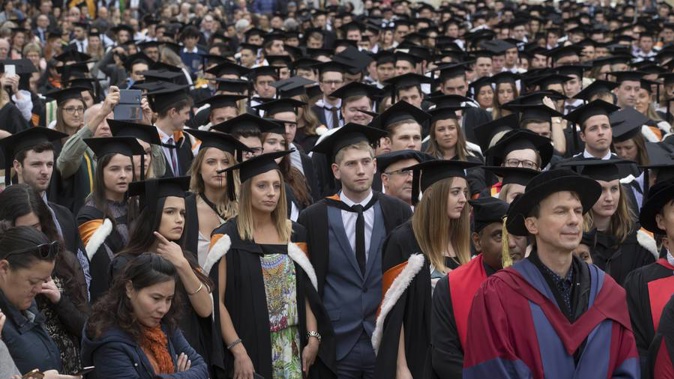 National has accused Government of shifting the goalposts on its fees-free policy. Above, Victoria University students at graduation in 2017. Photo / File
